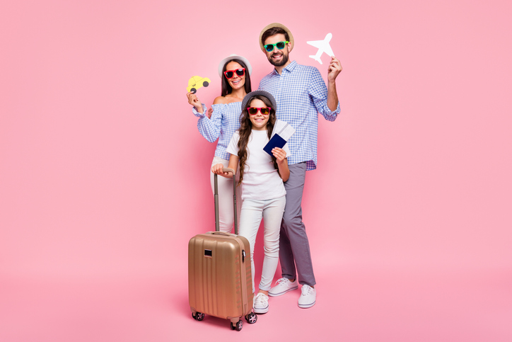 "Parents and their little daughter smiling under pink background Telecabbie excursions Andalucia"